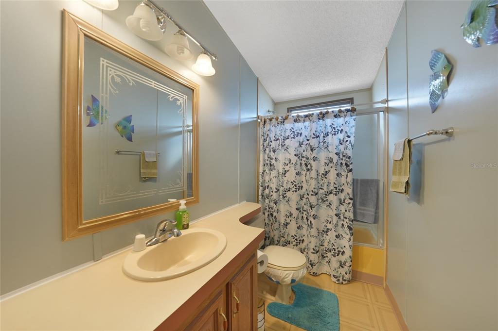 10101 Burnt Store Road, Unit 54 Punta Gorda, FL 33950 - Photo 22 of 28 a bathroom with a sink toilet and shower