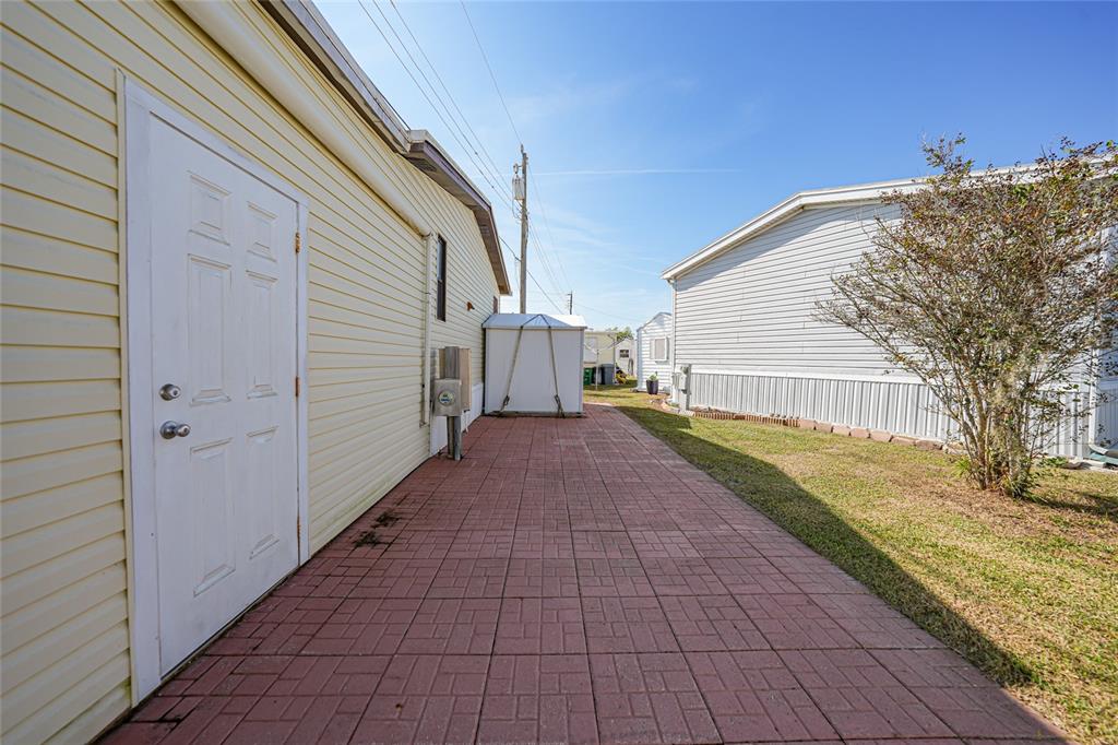 10101 Burnt Store Road, Unit 54 Punta Gorda, FL 33950 - Photo 23 of 28 a view of a back yard of the house