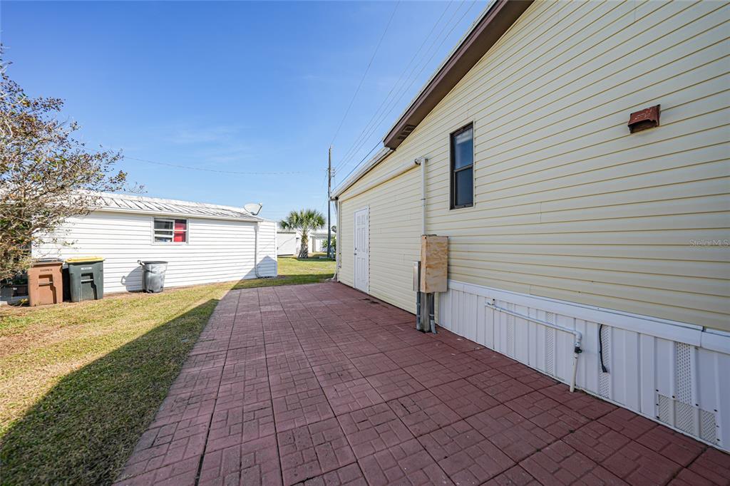 10101 Burnt Store Road, Unit 54 Punta Gorda, FL 33950 - Photo 25 of 28 a view of a house with a yard