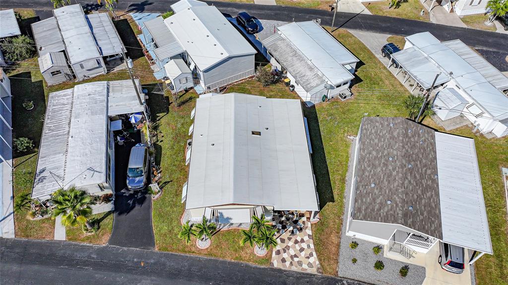 10101 Burnt Store Road, Unit 54 Punta Gorda, FL 33950 - Photo 3 of 28 an aerial view of a residential houses with outdoor space