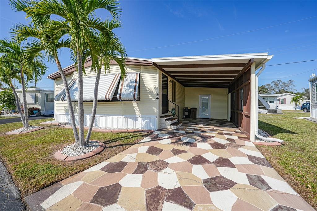 10101 Burnt Store Road, Unit 54 Punta Gorda, FL 33950 - Photo 4 of 28 a house view with garden space