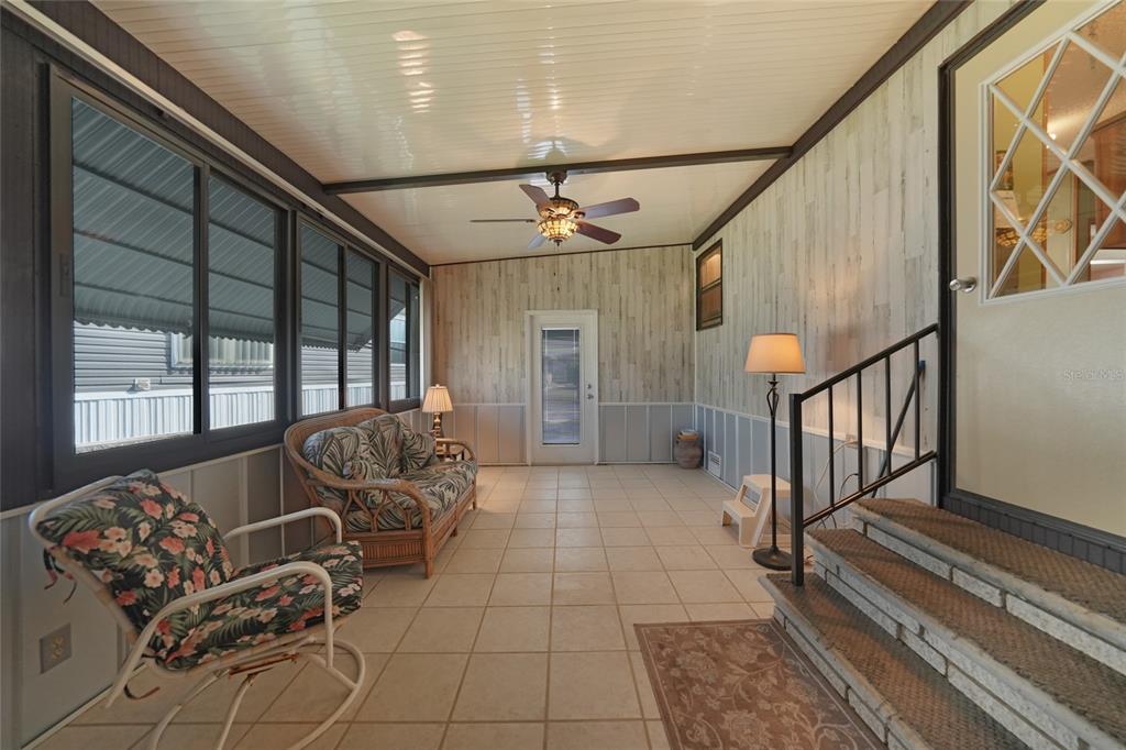 10101 Burnt Store Road, Unit 54 Punta Gorda, FL 33950 - Photo 6 of 28 a living room with furniture and stairs