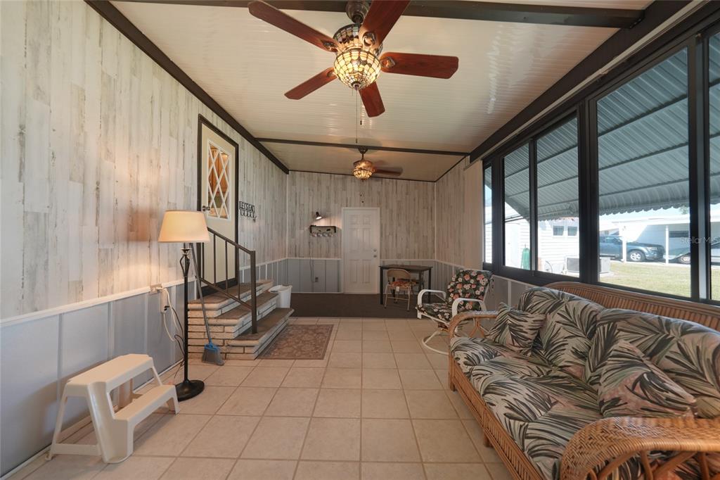 10101 Burnt Store Road, Unit 54 Punta Gorda, FL 33950 - Photo 7 of 28 a living room with furniture
