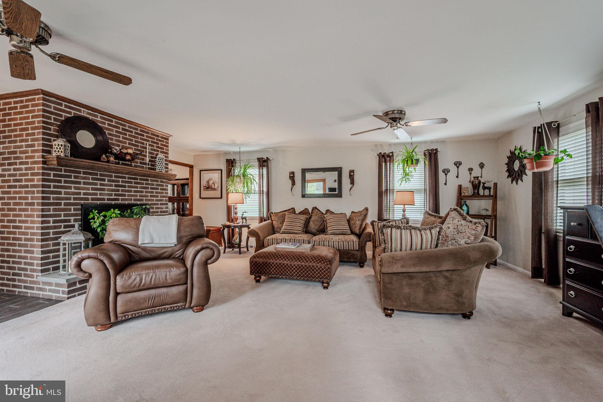 211 Old Ashley Drive Elkton, MD 21921 - Photo 14 of 50 a living room with furniture and a fireplace