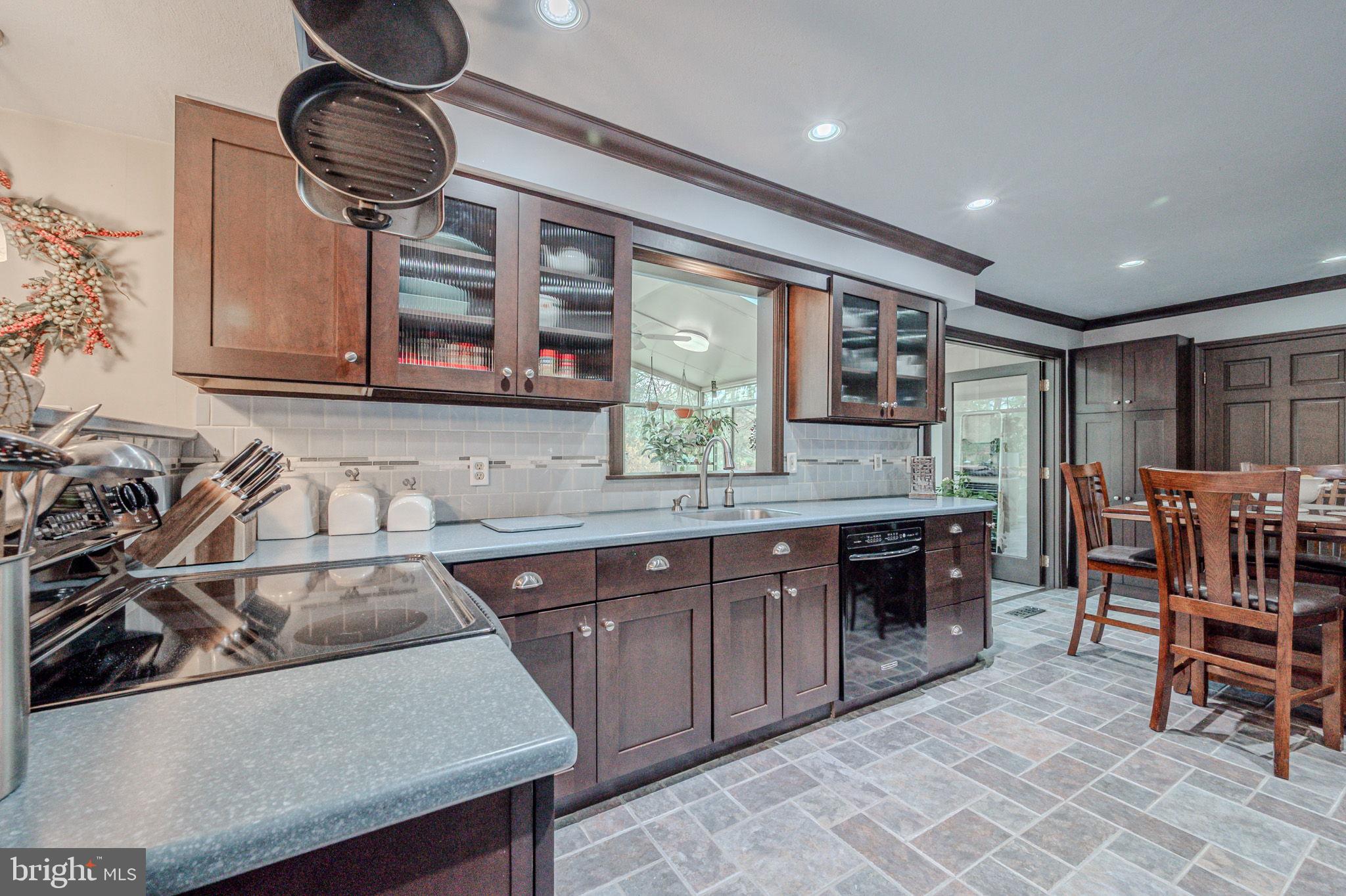 211 Old Ashley Drive Elkton, MD 21921 - Photo 18 of 50 a kitchen with stainless steel appliances granite countertop a sink table and chairs