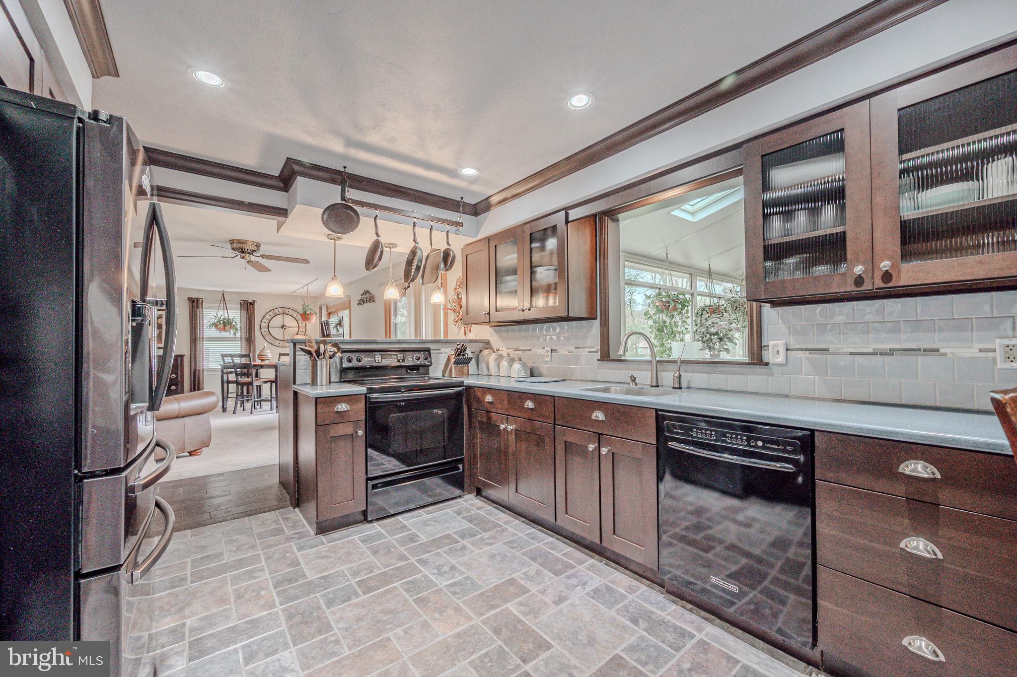 211 Old Ashley Drive Elkton, MD 21921 - Photo 19 of 50 a kitchen with stainless steel appliances granite countertop a sink stove and refrigerator