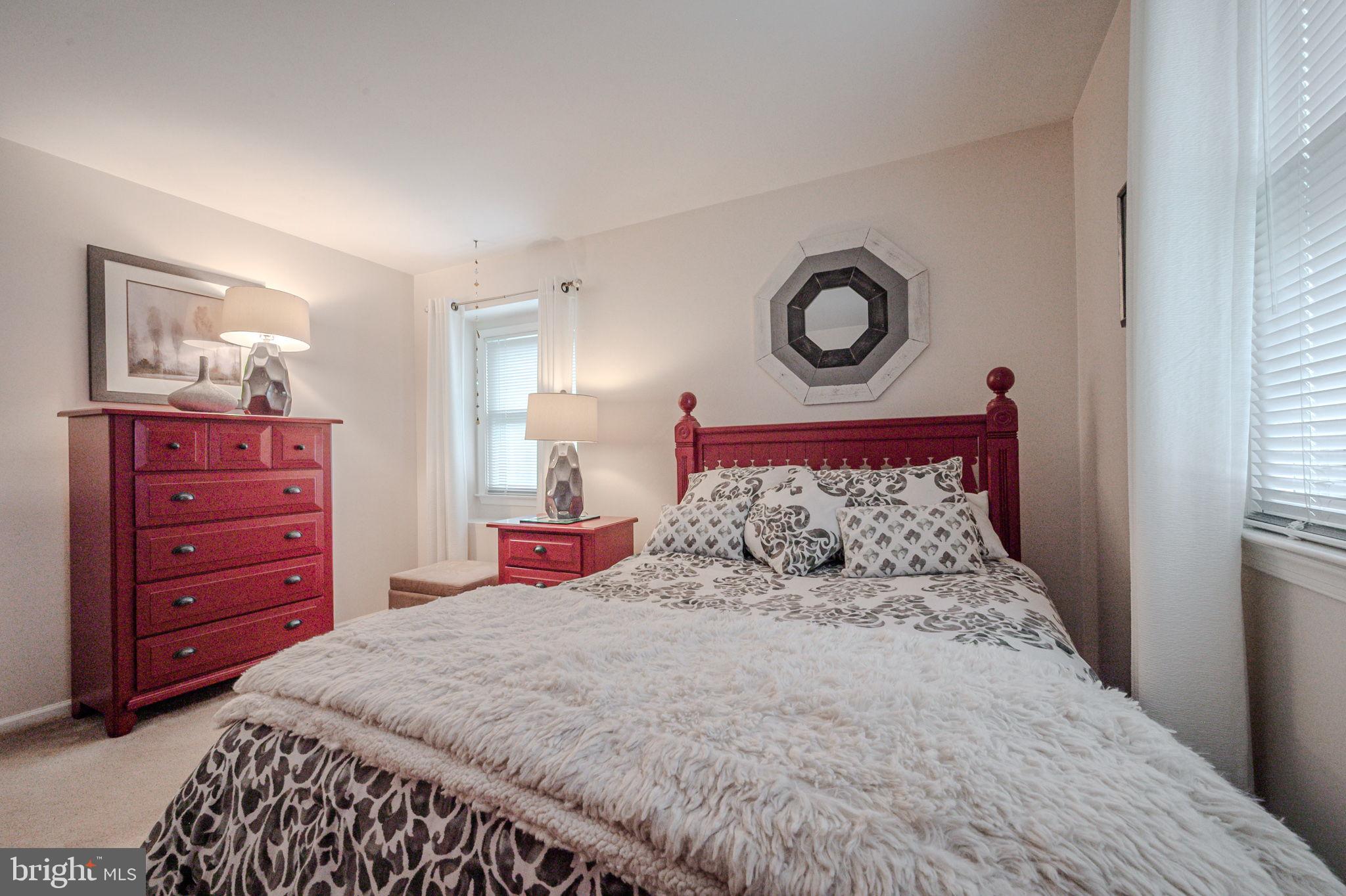 211 Old Ashley Drive Elkton, MD 21921 - Photo 29 of 50 a bedroom with a bed and a dresser
