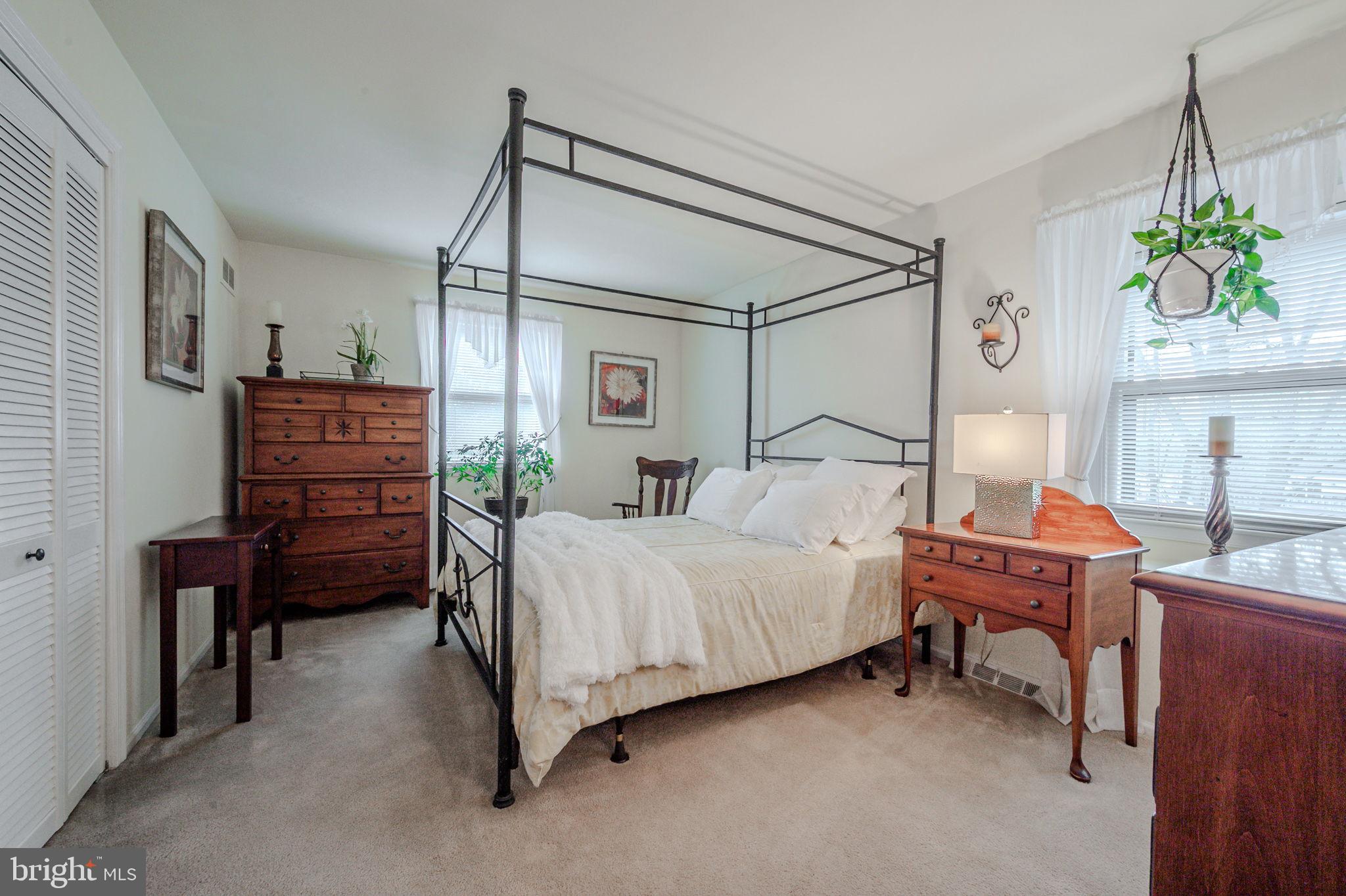 211 Old Ashley Drive Elkton, MD 21921 - Photo 32 of 50 a bedroom with a bed and a chandelier