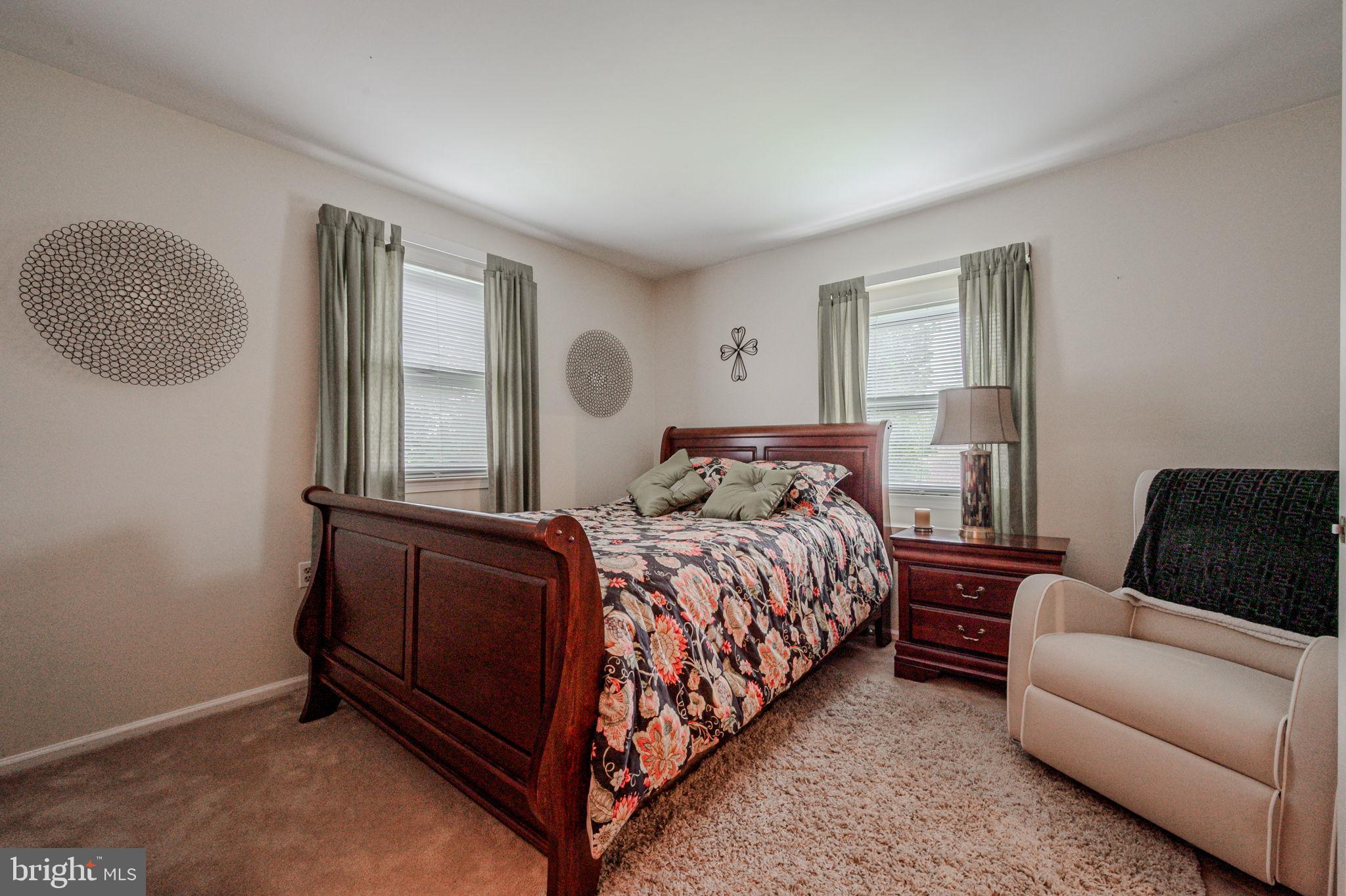 211 Old Ashley Drive Elkton, MD 21921 - Photo 37 of 50 a bedroom with a bed couch and window