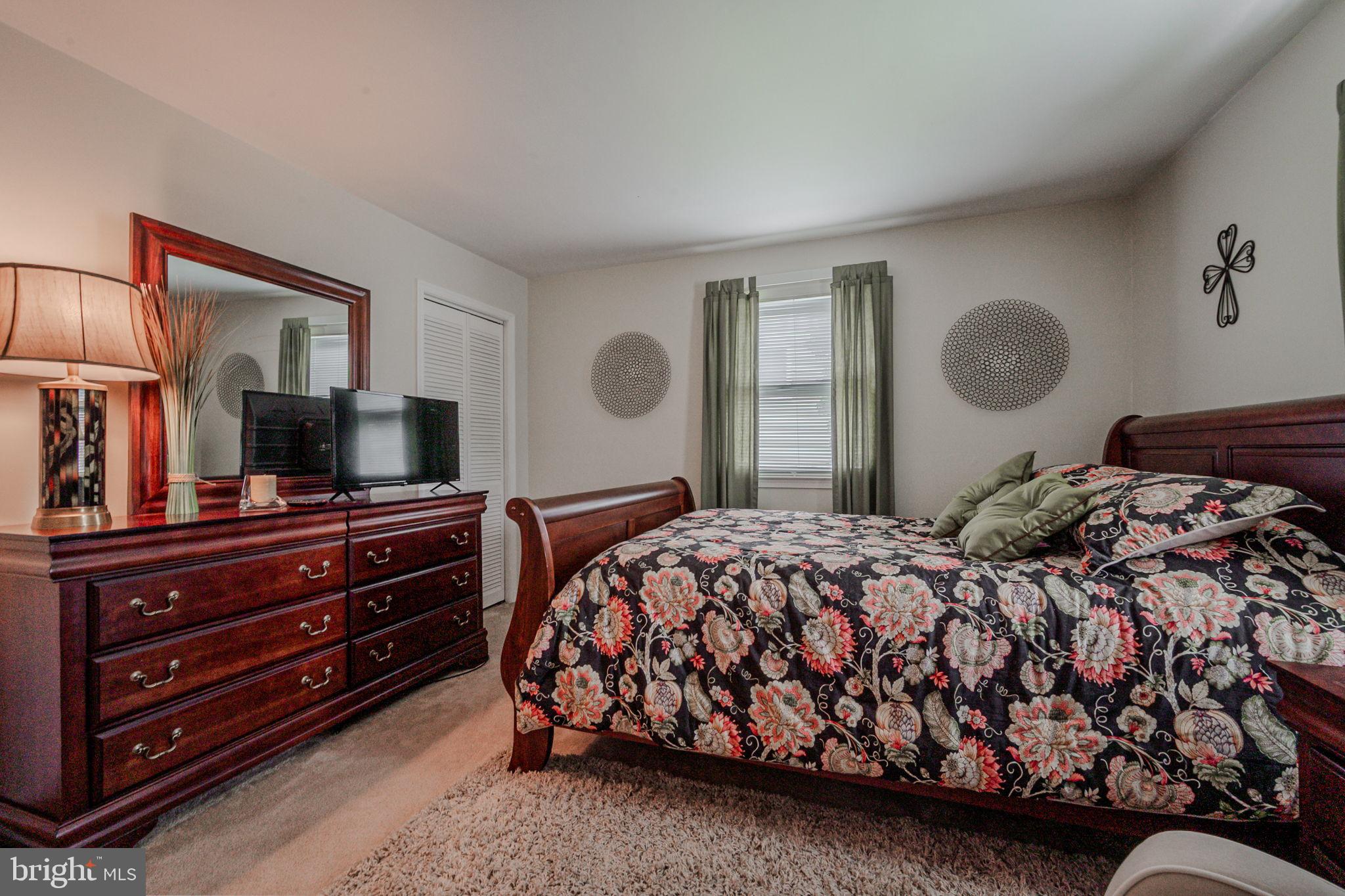 211 Old Ashley Drive Elkton, MD 21921 - Photo 38 of 50 a bedroom with a bed and wooden floor