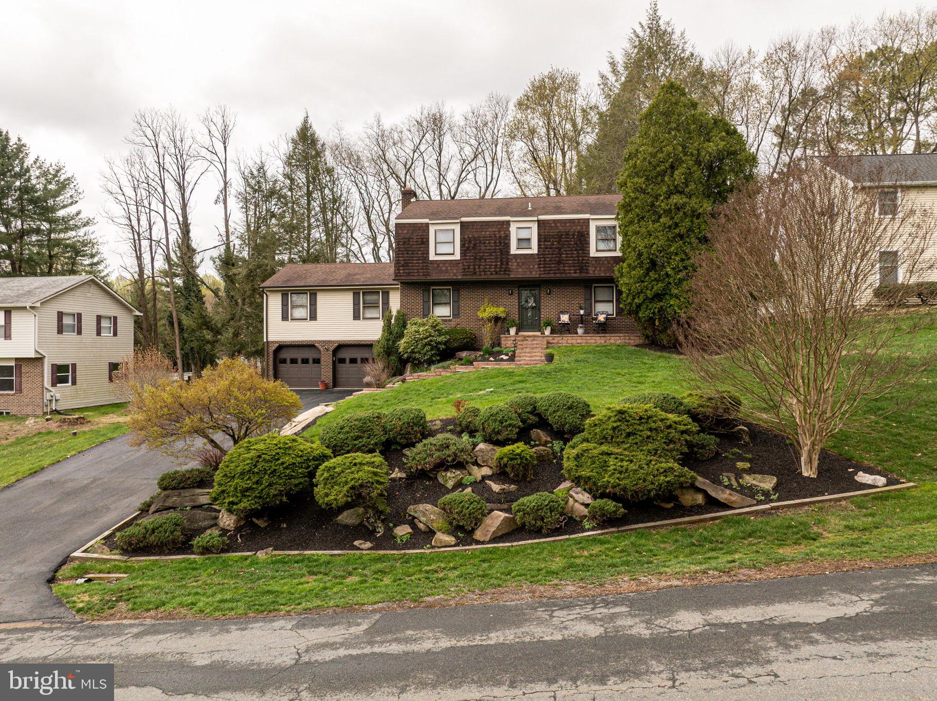 211 Old Ashley Drive Elkton, MD 21921 - Photo 44 of 50 a front view of a house with garden