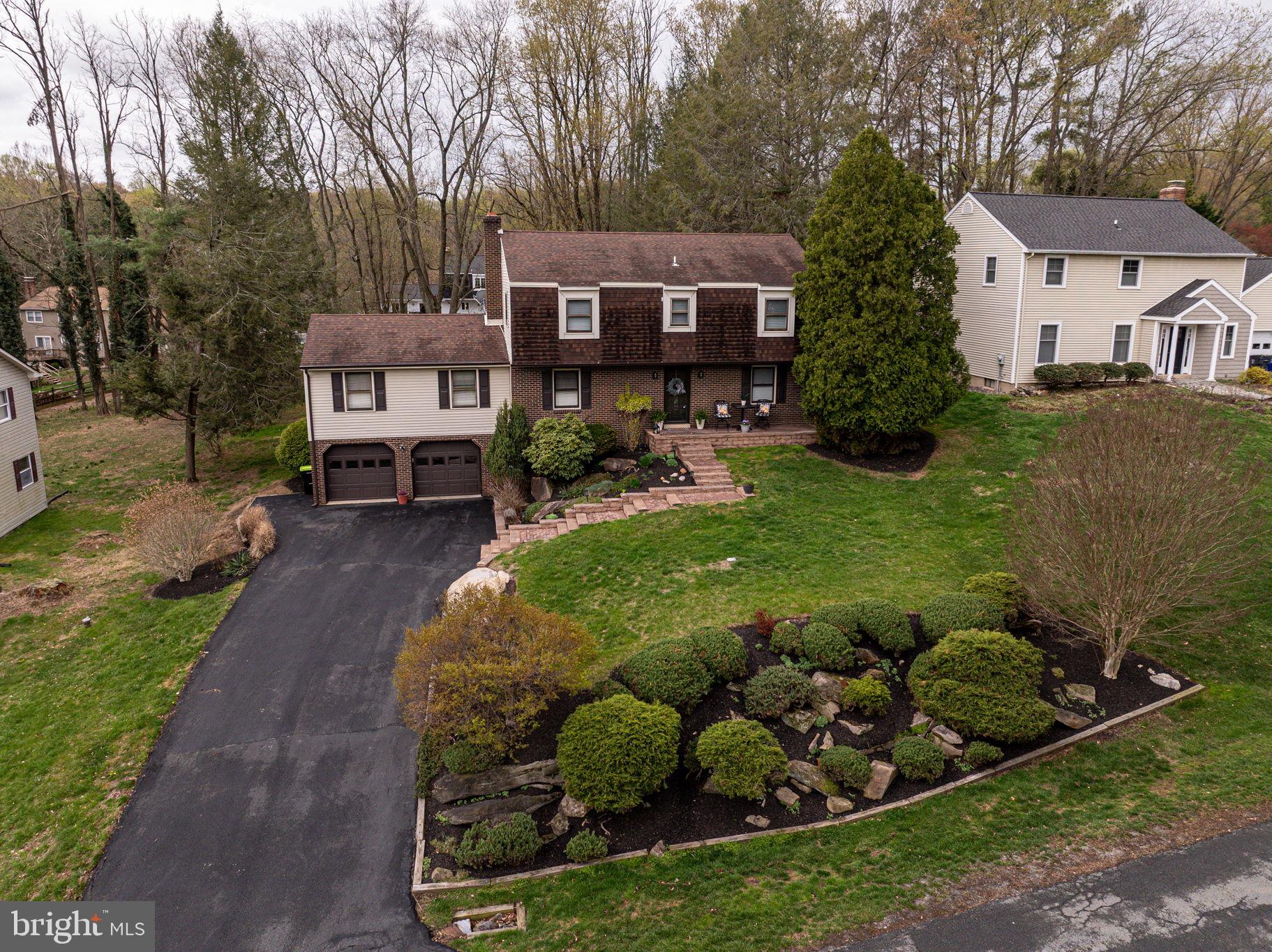 211 Old Ashley Drive Elkton, MD 21921 - Photo 46 of 50 a front view of a house with garden