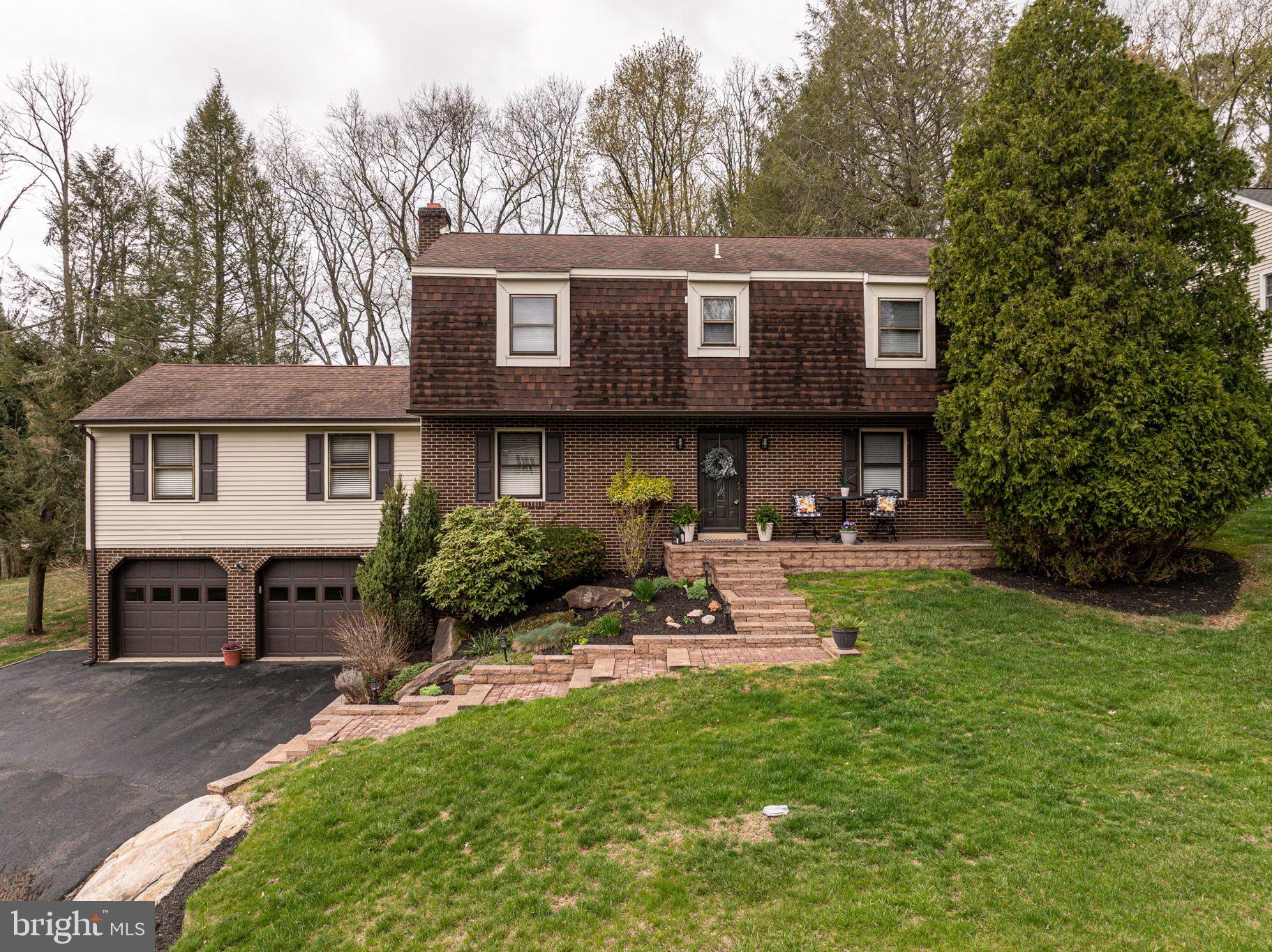 211 Old Ashley Drive Elkton, MD 21921 - Photo 50 of 50 a front view of a house with a garden and sitting area