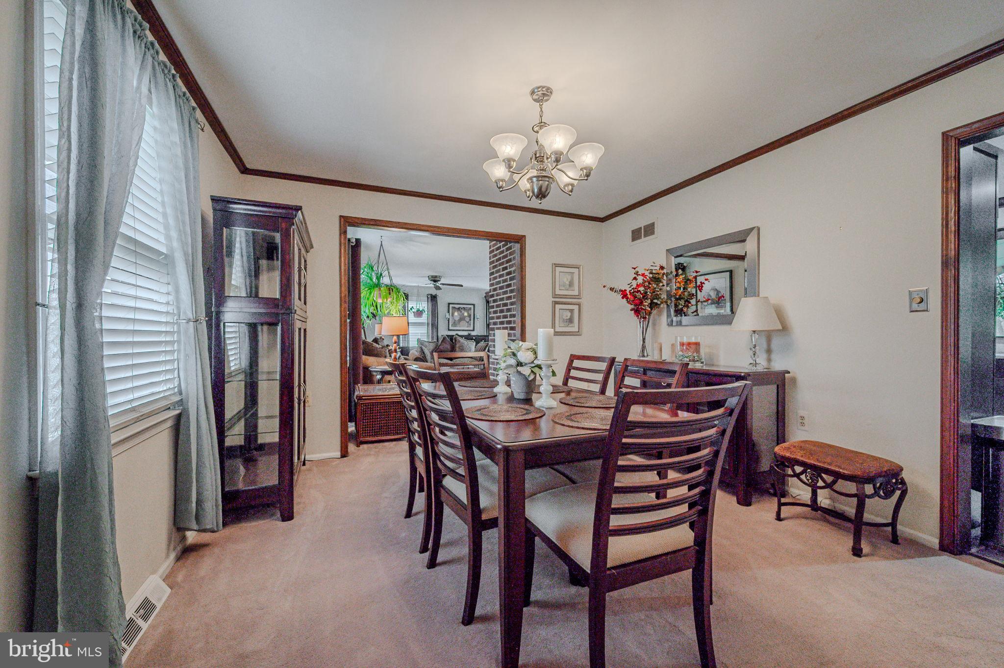 211 Old Ashley Drive Elkton, MD 21921 - Photo 10 of 50 a view of a dining room with furniture and chandelier