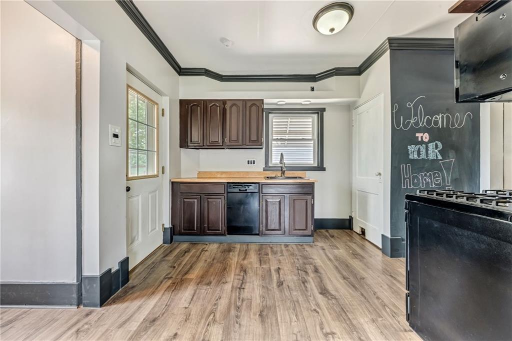 215 Independence Road Avella, PA 15312 - Photo 15 of 36 a kitchen with stainless steel appliances granite countertop a stove a sink and a refrigerator