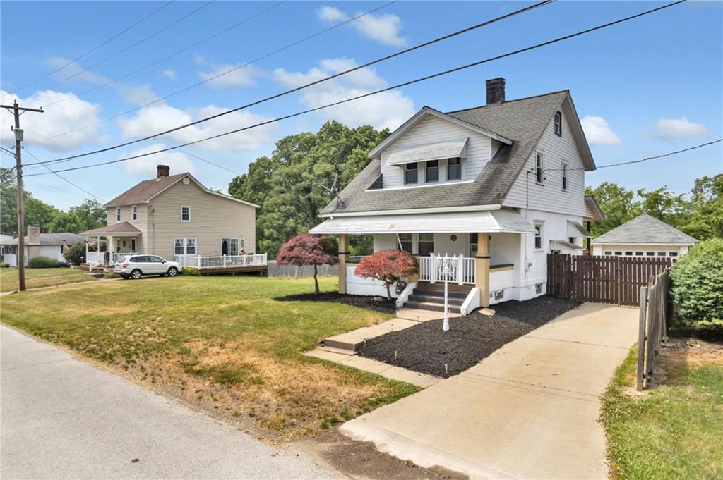 215 Independence Road Avella, PA 15312 - Photo 3 of 36 a front view of a house with garden