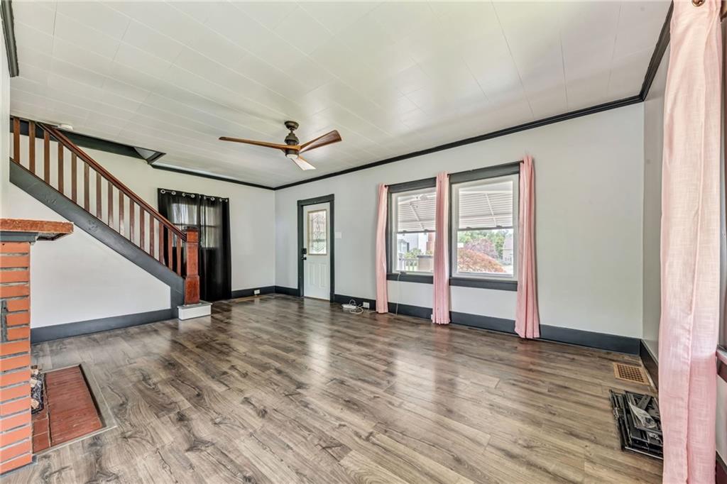 215 Independence Road Avella, PA 15312 - Photo 10 of 36 a view of an empty room with wooden floor and a window
