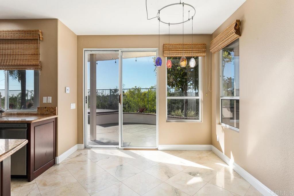 6947 Dusty Rose Place Carlsbad, CA 92011 - Photo 18 of 50 a view of an entryway with a livingroom