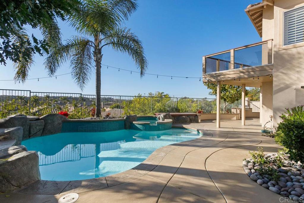 6947 Dusty Rose Place Carlsbad, CA 92011 - Photo 2 of 50 a front view of a house with garden