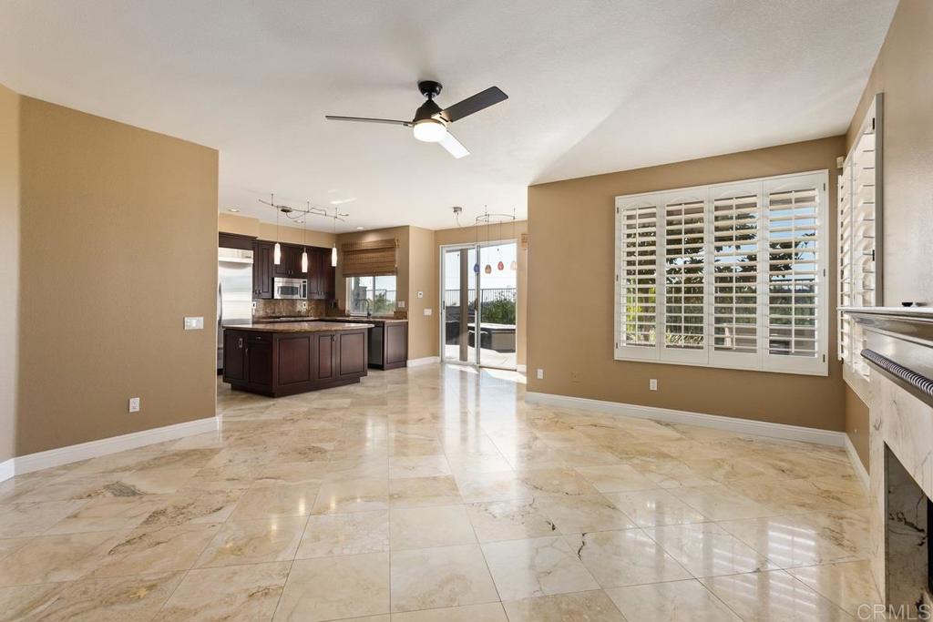 6947 Dusty Rose Place Carlsbad, CA 92011 - Photo 21 of 50 a view of a livingroom with a fireplace