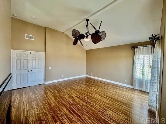 6947 Dusty Rose Place Carlsbad, CA 92011 - Photo 24 of 50 a view of an empty room with wooden floor and a window