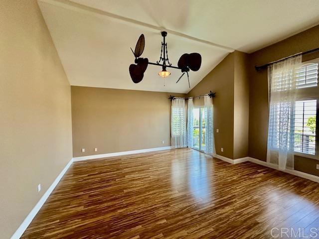 6947 Dusty Rose Place Carlsbad, CA 92011 - Photo 25 of 50 a view of an empty room with wooden floor and a window