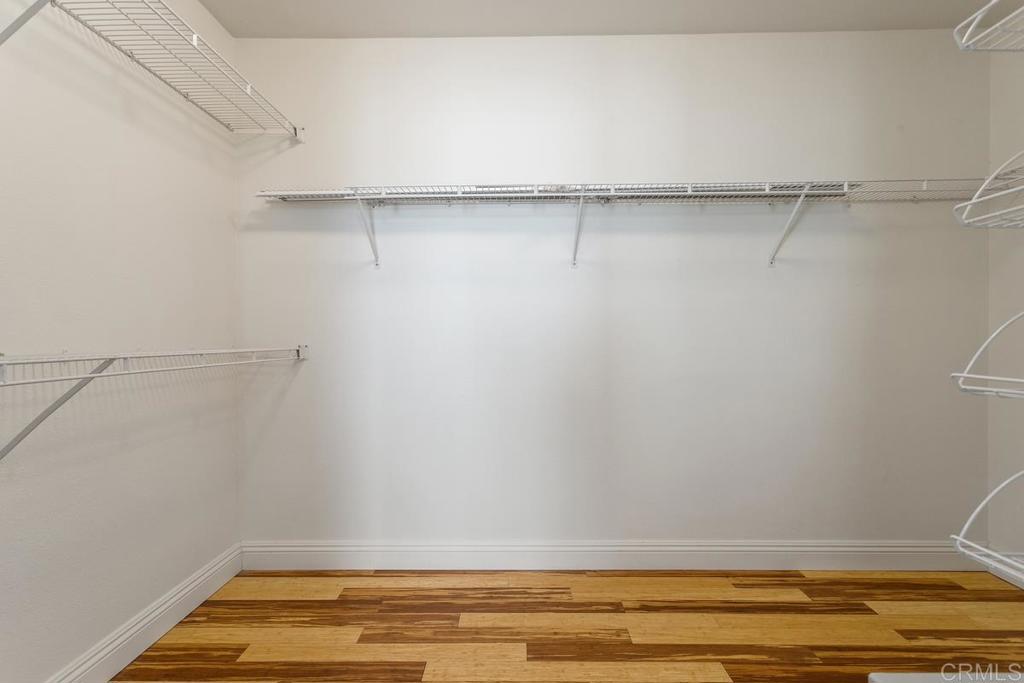 6947 Dusty Rose Place Carlsbad, CA 92011 - Photo 26 of 50 a view of a room with racks on the wall