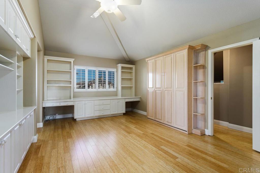 6947 Dusty Rose Place Carlsbad, CA 92011 - Photo 30 of 50 an empty room with wooden floor and windows
