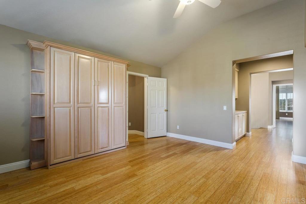 6947 Dusty Rose Place Carlsbad, CA 92011 - Photo 31 of 50 a view of an empty room with wooden floor