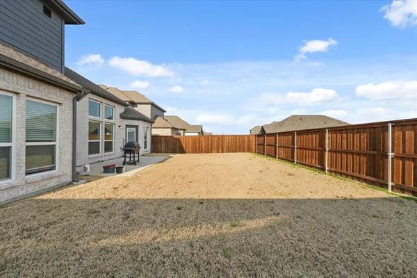 a view of backyard of house