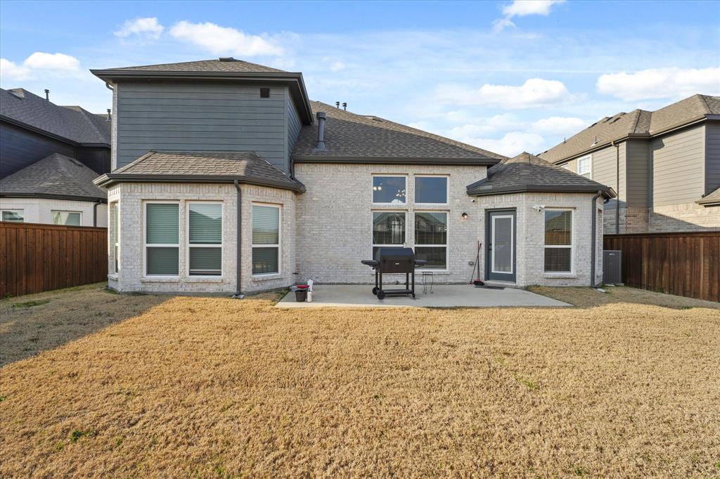 1111 Alaska Drive Forney, TX 75126 - Photo 15 of 30 front view of a house with a yard