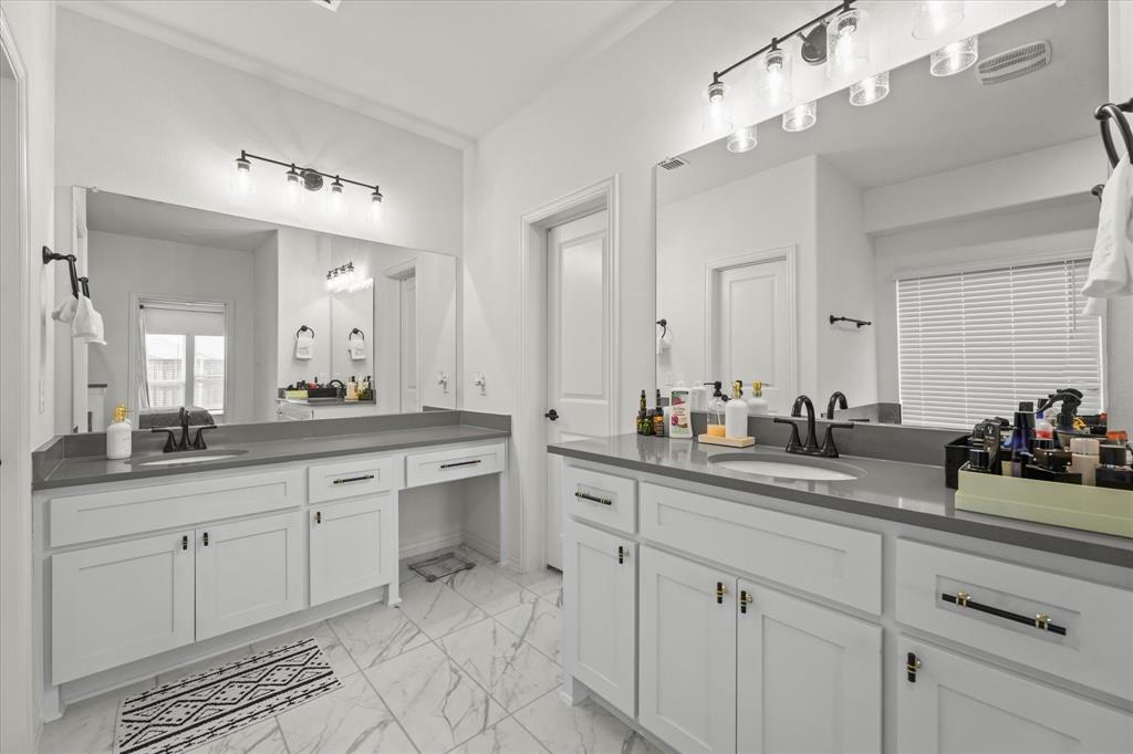 1111 Alaska Drive Forney, TX 75126 - Photo 19 of 30 a bathroom with a sink vanity and mirror