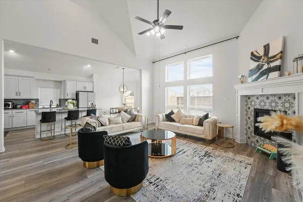 a living room with stainless steel appliances kitchen island granite countertop furniture and a view of kitchen