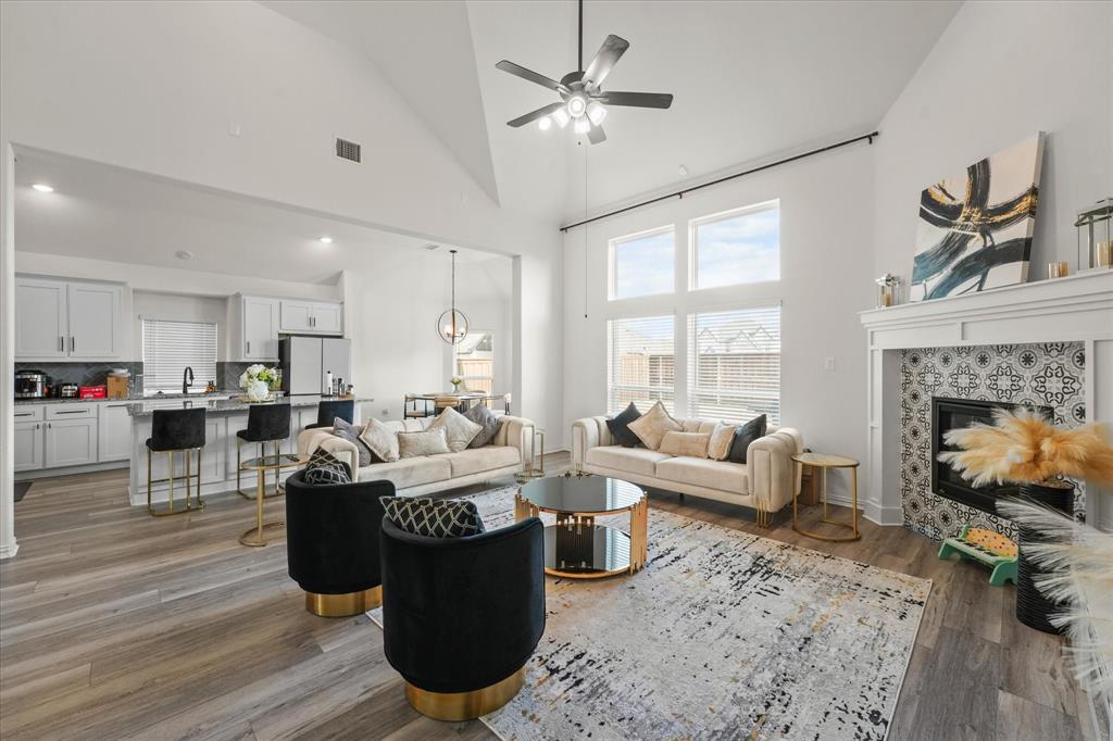 1111 Alaska Drive Forney, TX 75126 - Photo 26 of 30 a living room with furniture and a fireplace
