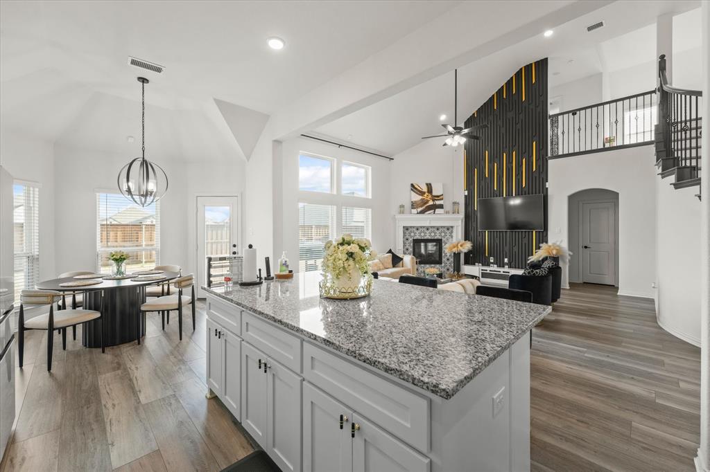 1111 Alaska Drive Forney, TX 75126 - Photo 28 of 30 a kitchen with sink stove and cabinets