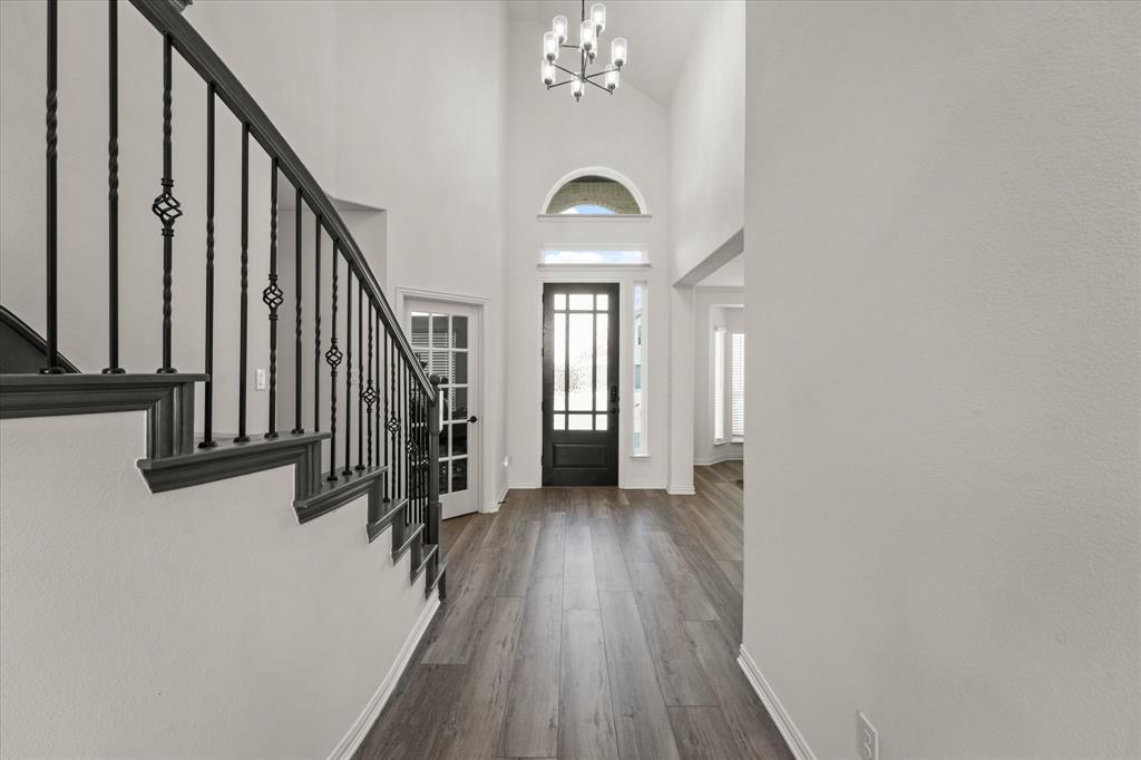 1111 Alaska Drive Forney, TX 75126 - Photo 5 of 30 a view of a hallway with wooden floor and staircase
