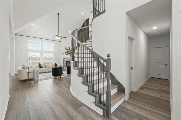 a view of entryway and hall with wooden floor