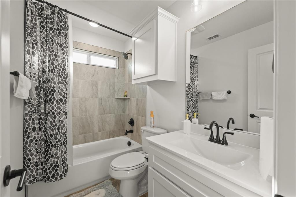 1111 Alaska Drive Forney, TX 75126 - Photo 9 of 30 a bathroom with a sink toilet and shower