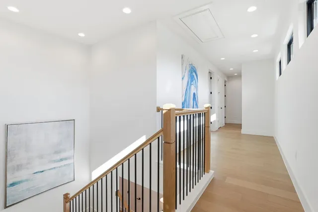 a view of a hallway with windows