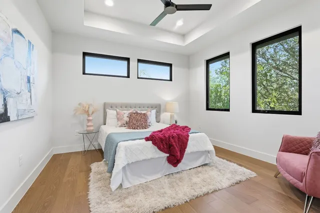 a living room with a bed furniture and a window