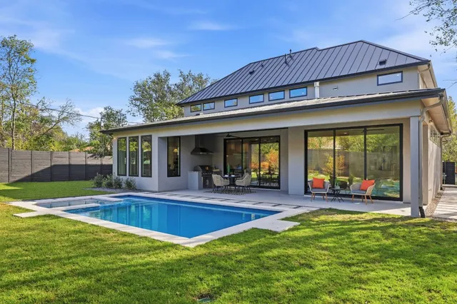 a view of pool with outdoor seating