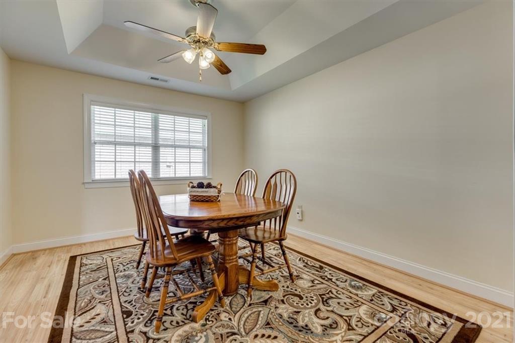 704 Beechnut Court Fort Mill, SC 29708 - Photo 24 of 46 a view of a dining room with furniture and window