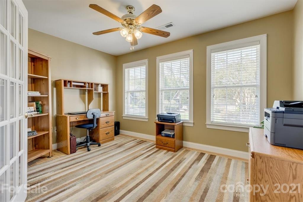 704 Beechnut Court Fort Mill, SC 29708 - Photo 25 of 46 a view of workspace with wooden floor and windows