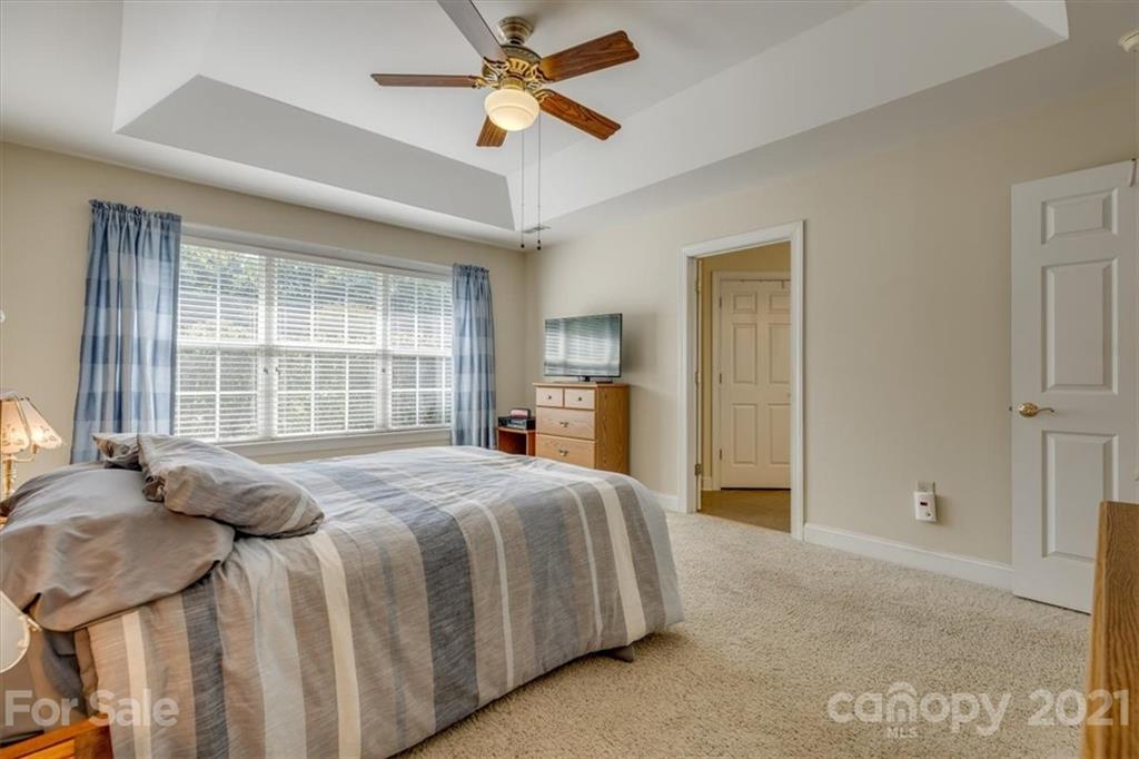 704 Beechnut Court Fort Mill, SC 29708 - Photo 28 of 46 a spacious bedroom with a bed and a large window