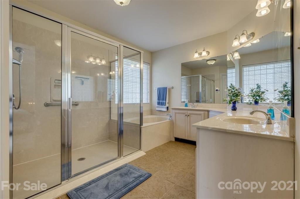 704 Beechnut Court Fort Mill, SC 29708 - Photo 30 of 46 a bathroom with a double vanity sink mirror and shower