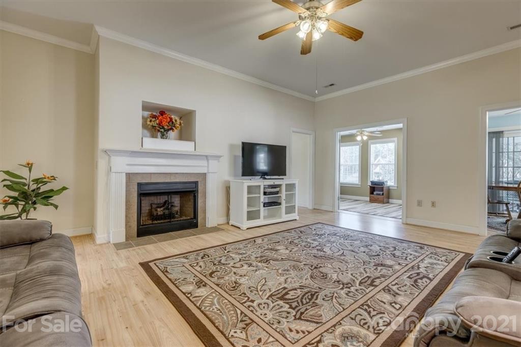 704 Beechnut Court Fort Mill, SC 29708 - Photo 7 of 46 a living room with a couch and a fireplace