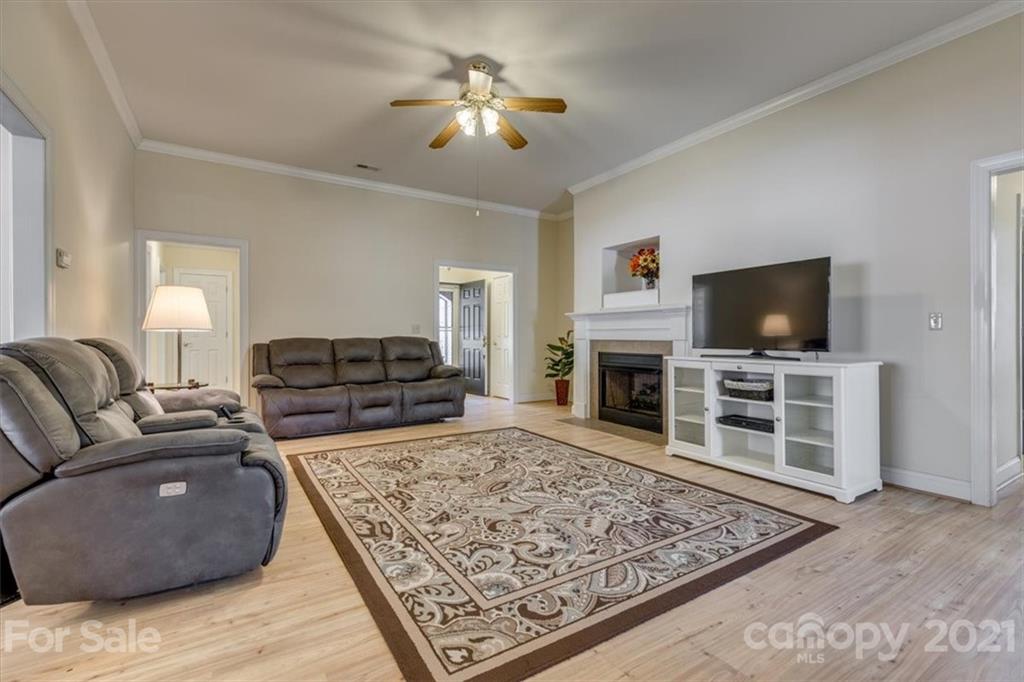 704 Beechnut Court Fort Mill, SC 29708 - Photo 8 of 46 a living room with furniture and a flat screen tv