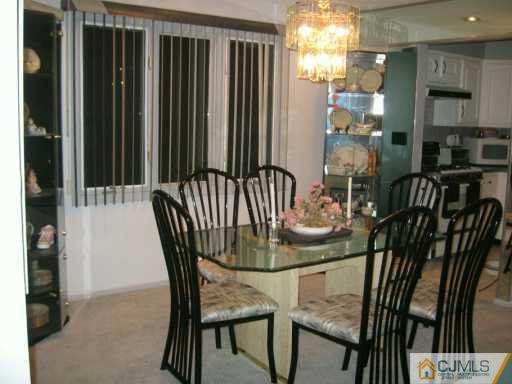 5 Chelsea Court Sayreville, NJ 08859 - Photo 4 of 8 a view of a dining room with furniture and window