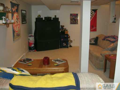 5 Chelsea Court Sayreville, NJ 08859 - Photo 8 of 8 a bathroom with a tub and shower