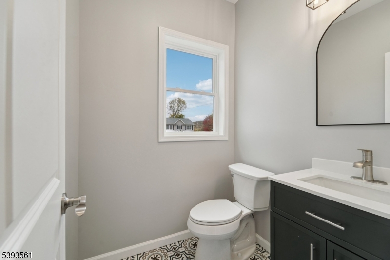 120 Addison Street Boonton, NJ 07005 - Photo 13 of 44 a bathroom with a toilet sink vanity and mirror